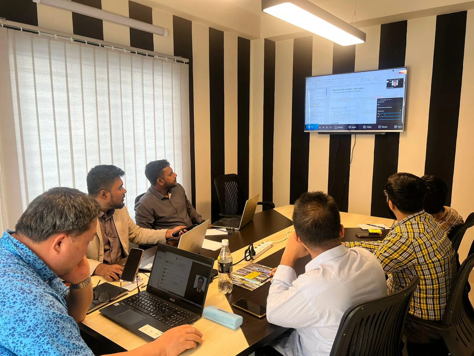 The ABESL team in the head office meeting room